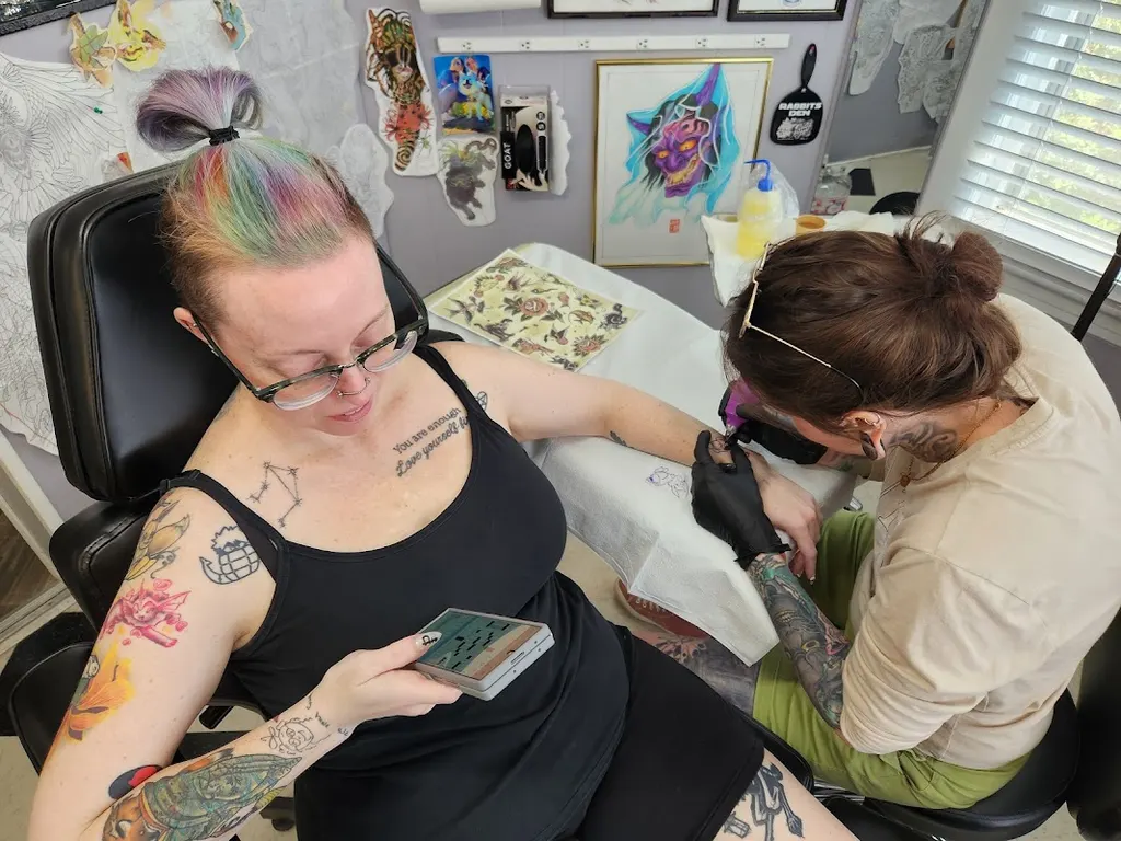 Rabbits Den Tattoo and Piercing Parlor — Tattoo and piercing shop in Milltown